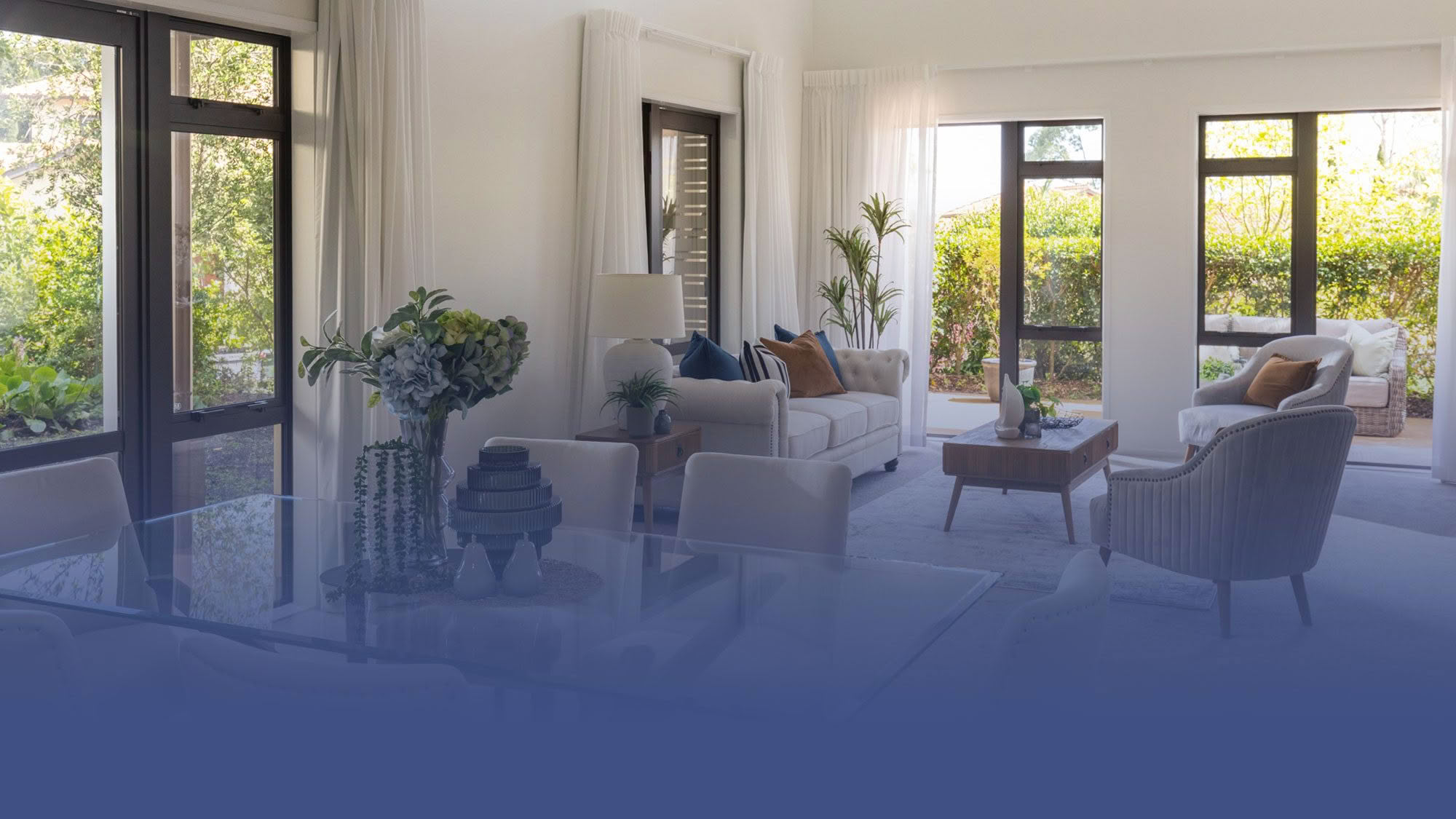 Light-filled apartment lounge with garden views in The Terraces at St Andrew's Village