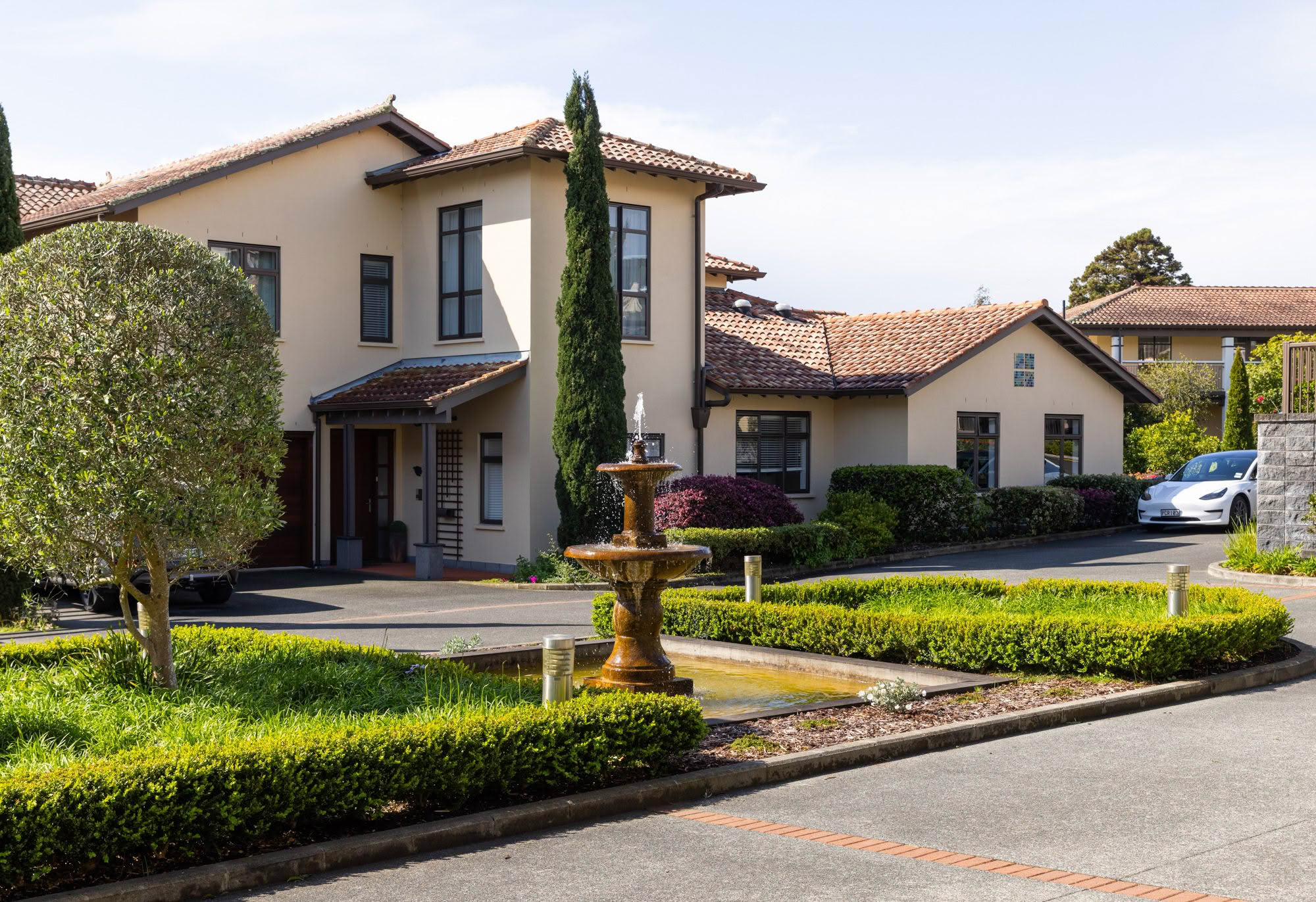 Architecturally designed villa with manicured gardens and fountain at St Andrew's Village